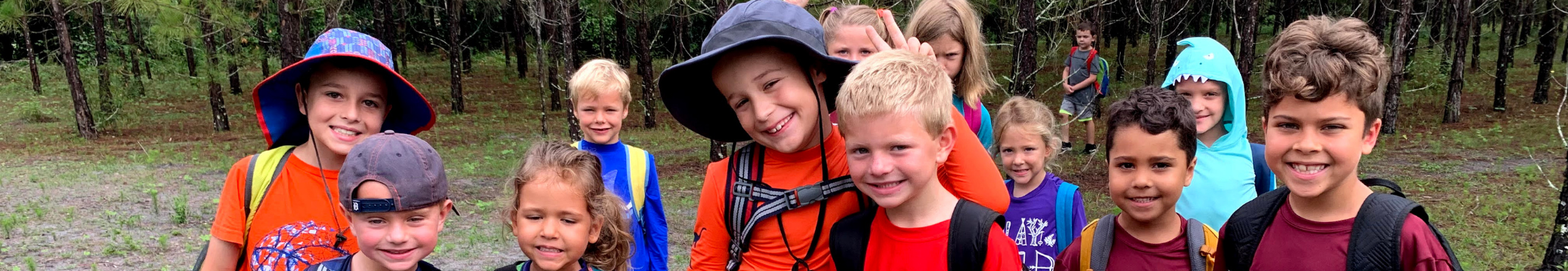 Group of kids smiling at Treeline Enrichment