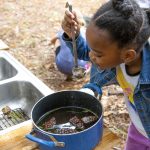 Central Florida Outdoor Therapy and Play; child playing in the mud kitchen