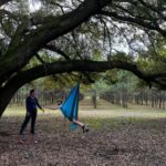 child and therapist using a swing in therapy session