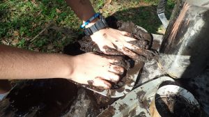 nature sensory experiences: hands in mud play